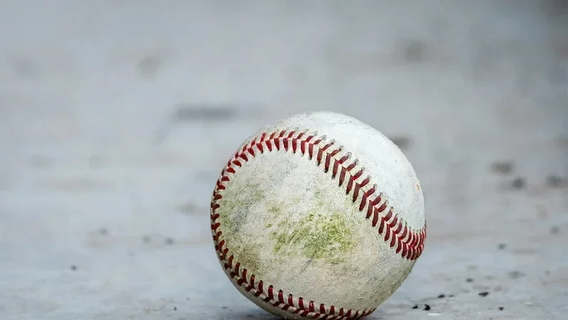 A ball lies in a dugout during a high school baseball game held at Pleasant Grove High School in Pleasant Grove on Friday, April 25, 2025.